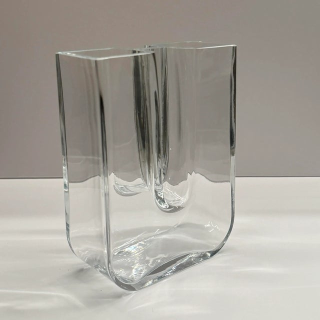 Listing Description: Explore the elegance of Scandinavian design with this Bertil Vallien U-shaped vase for Kosta Boda,...