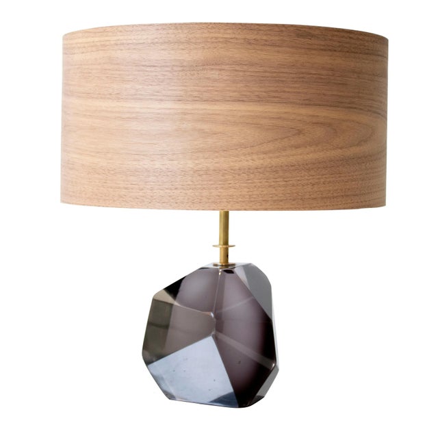 Table lamp made of Murano faceted glass in translucent dark grey and brass stem made by hand. Walnut lamp shade. Up to...
