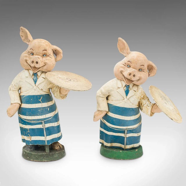 This is a pair of antique decorative butchery pigs. An English, plaster shop display figure, dating to the Edwardian...