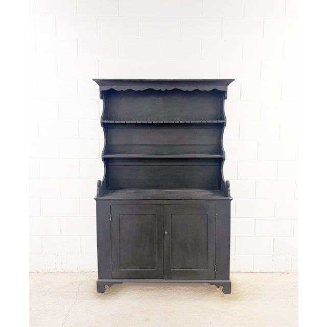 This classic antique rustic pine hutch, also known as a Welsh dresser, dates back to the late 19th century. It features a...