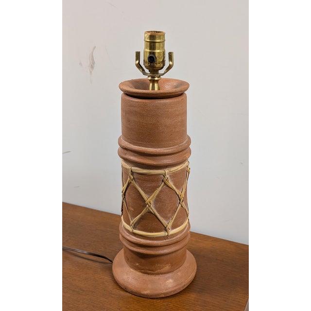This pottery table lamp with woven rattan rope makes a perfect decorative piece for any table, study, entryway, living...