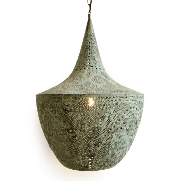 Beautiful verdigris handmade copper lantern with perforated decorative design that emanates intricate light patterns. Open...