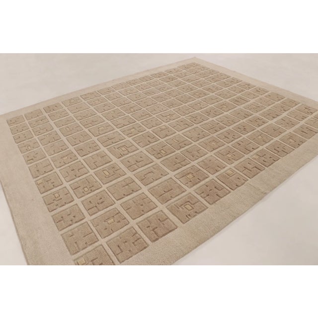 Hand-knotted in premium wool, this contemporary 9x12 rug joins Rug & Kilim’s Art Deco collection. The design layout...