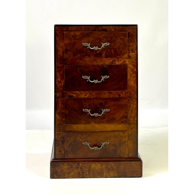 Vintage Italian-made four-drawer nightstand or side chest. Masterfully crafted with a dramatically figured burl wood...