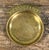 This brass catchall dish features a shallow oval form with a protruding tab stamped with the words "POCKET CHANGE" in...