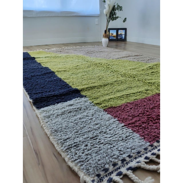 One-of-a-kind handwoven contemporary Moroccan rug. Four color fields with no hierarchy: a bold navy stripe, a diagonal...