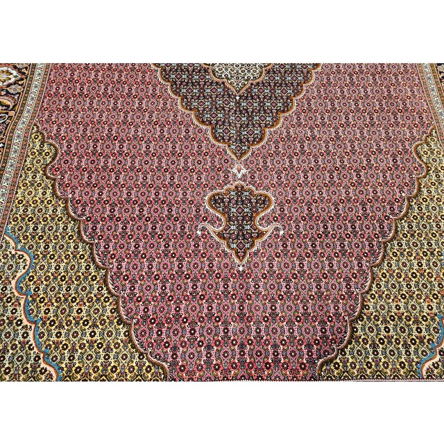 Discover one of the most beautiful and finest examples in our collection: this magnificent Vintage Persian Tabriz Mahi...