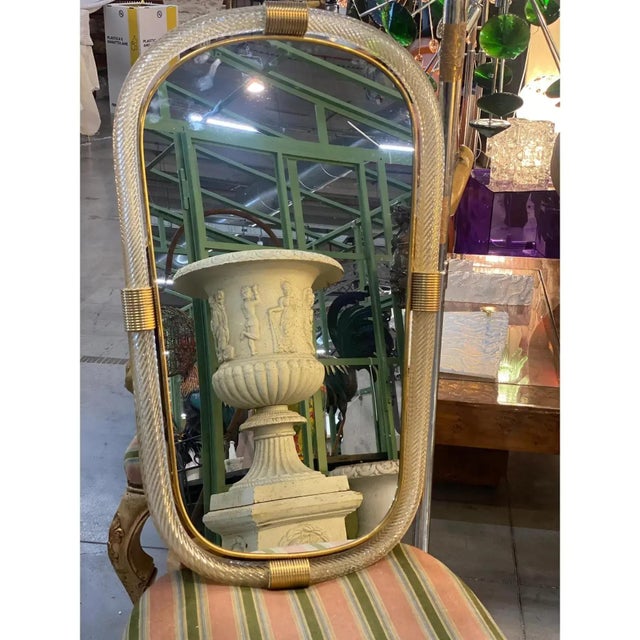 Pair of italian murano glass wall mirrors in gold leaf “torciglione” venetian design scenographic wall mirror in brass...