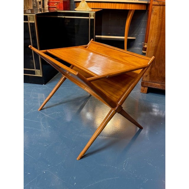 The Edward Wormley Magazine Table is a stylish and functional piece of furniture designed to hold and display magazines in...