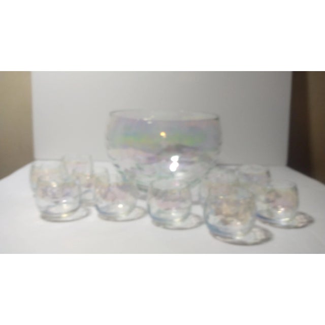 Vintage iridescent punch bowl & 10 cups made by West Virginia Glass Specialties in the 1960s. The bowl is 6 1/2" tall and...
