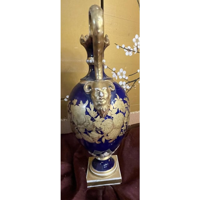 This exquisite 19th-century carafe, attributed to the renowned Derby porcelain works, showcases the masterful...