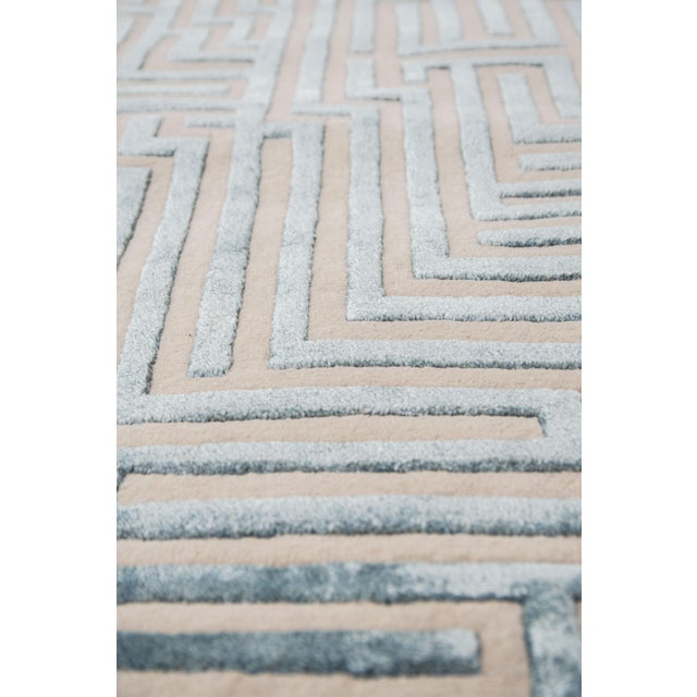 Walk the maze with the Anatolia geometric handmade rug design, named after the birthplace of the ancient word for...