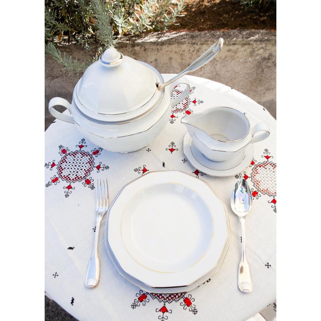 White porcelain with a platinum rim. Platinum Heirloom. The set comprises the following 57 pieces: 24 dinner plates: 23.8...