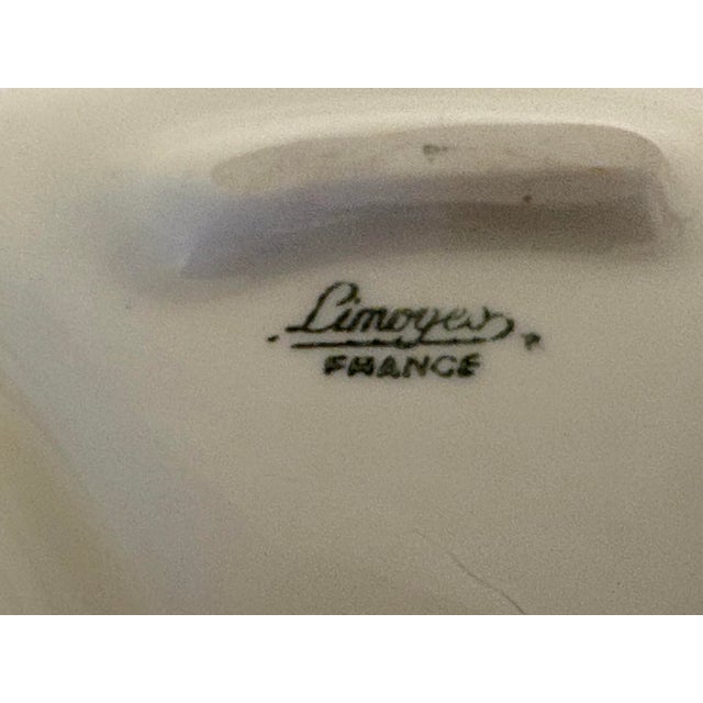 This Limoges divided porcelain nut or candy dish from France featuring hand painted bird motifs in each of the 4 sections...