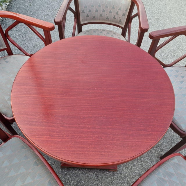 Exceptional thonet vienna dining ensemble from 1987, comprising a round pedestal dining table and five matching armchairs,...