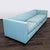 This CB2 3-seat sofa features a sleek, modern design with clean lines and a light blue fabric. It offers comfortable,...