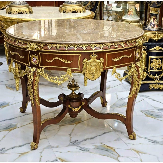 Elevate your space with this elegant Victorian French style center table, crafted in solid wood and adorned with refined...
