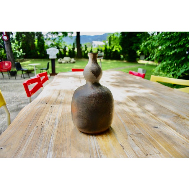 Wood-fired calabash vase with beautiful shades of orange, blue, pink, and beige, in perfect condition. This piece has an...