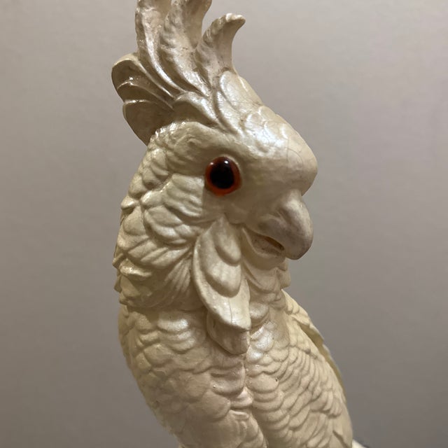 A stunning vintage mid-century ceramic cockatoo figurine, hand-painted with meticulous attention to detail. This piece...