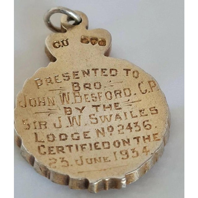 A distinctive British sterling silver-gilt presentation medallion dating to 1934, hallmarked in Chester and associated...