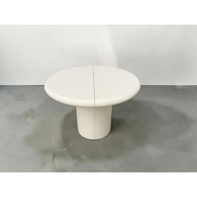 Beautiful 1970s Karl Springer style extendable dining table featuring a sculptural mushroom-style base, rounded edges, and...