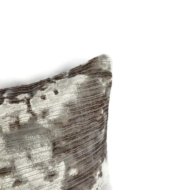 From Fabricut is ATELIER Velvet in the color Platinum pillow cover. A textured, abstract pattern with a blend of gray and...
