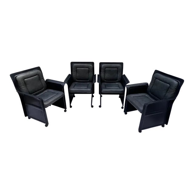 A stylish, sophisticated, set of 4 lounge leather armchairs designed by the high-end furniture maker, iV Mariani iV,...