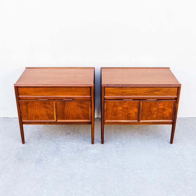 A newly refinished pair of mid century modern walnut nightstands or bedside tables by Barney Flagg for Drexel's Parallel...