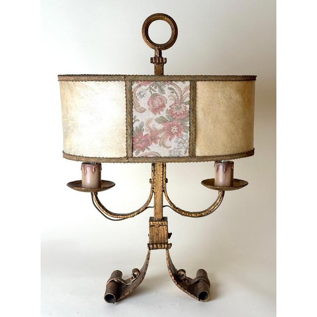 An exceptional large two-light table lamp, crafted in italy during the mid-20th century. The sculptural hand-worked iron...