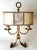 An exceptional large two-light table lamp, crafted in italy during the mid-20th century. The sculptural hand-worked iron...