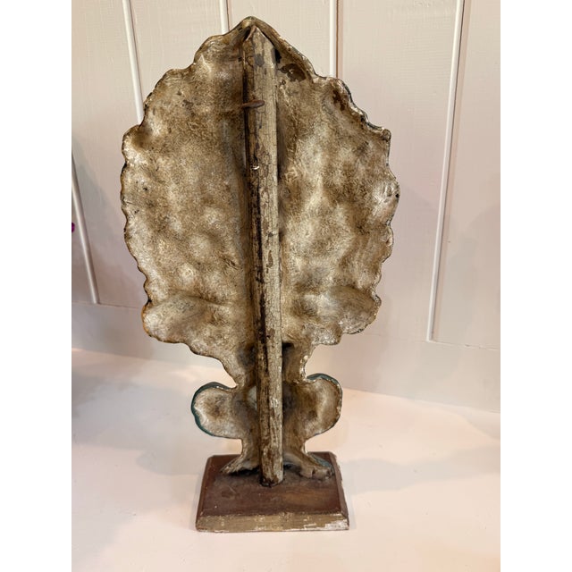 A striking pair of Antique late 20th-century American folk art style pressed papier-mâché mantel garnitures. Designed in...