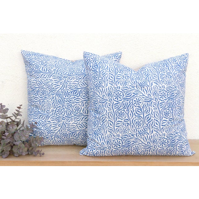 This magnificent pair of decorative pillows is a celebration of dual textile artistry. Each large 24-inch square pillow is...