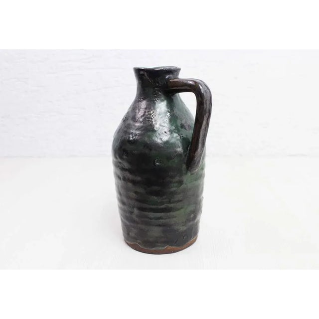 Pretty enameled ceramic pitcher. Ideal in your table service to put water, a lemonade or juices, this charming pitcher...