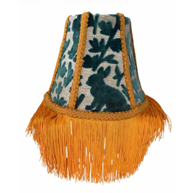 A striking custom lampshade handcrafted in luxurious Covington “Luv Bunny” velvet fabric, featuring whimsical teal bunny...