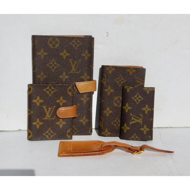 A group of 5 vintage pieces, a luggage tag, a key purse, a card wallet, a coin purse and wallet, and a document wallet for...