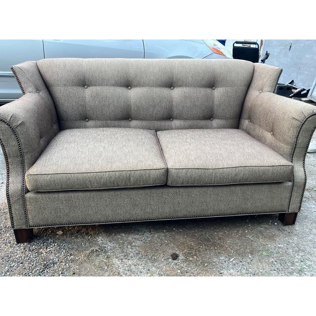 Beautifully crafted Hickory Chair loveseat featuring tailored upholstery in a warm chestnut brown/tan herringbone fabric,...