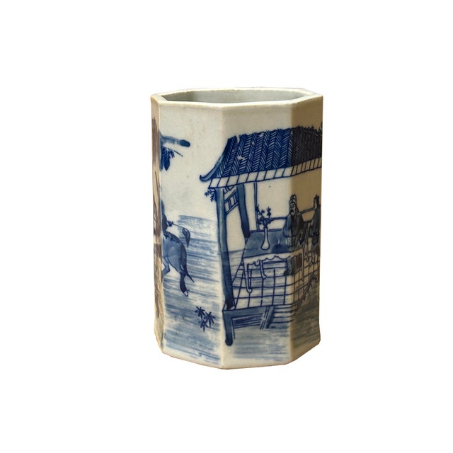 This exquisite small 4-inch blue and white porcelain vessel features a distinctive multi-faceted, octagonal silhouette...