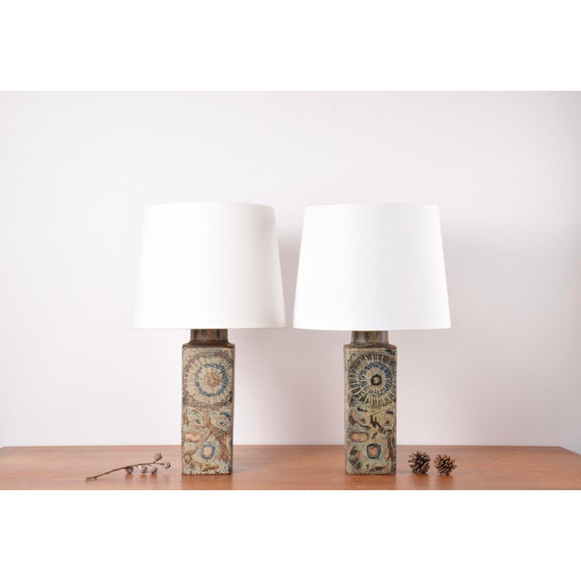 Pair of table lamps designed by Nils Thorsson for Royal Copenhagen and made circa 1970s. They have a tactile abstract...