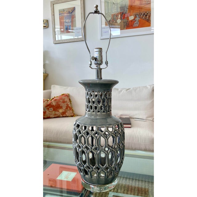 Beautiful Hollywood Regency 1970s gray glazed lattice ceramic table lamp with lucite base. Great addition to your modern...
