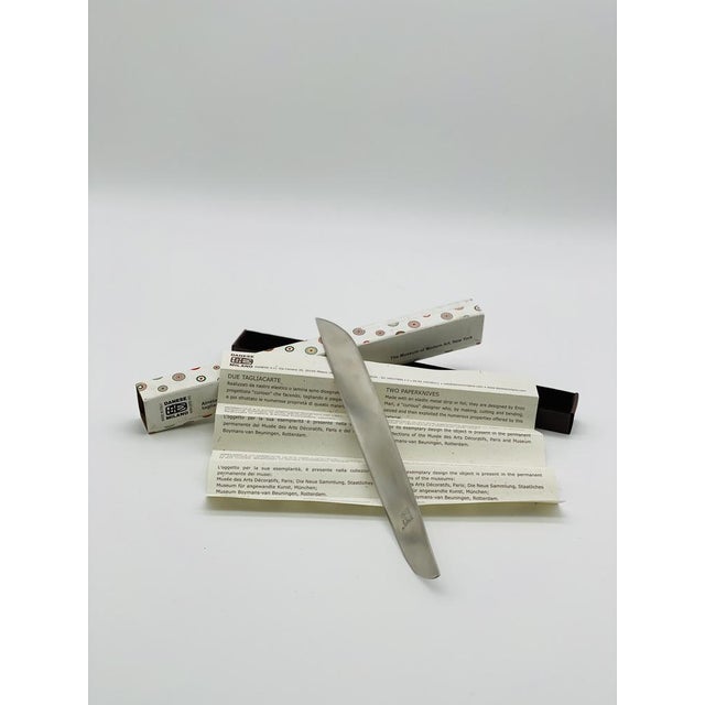 Two -cut Tagliacarte design Enzo Mari 1962 in satin stainless steel, with propeller curvature and handless. Handmade case...