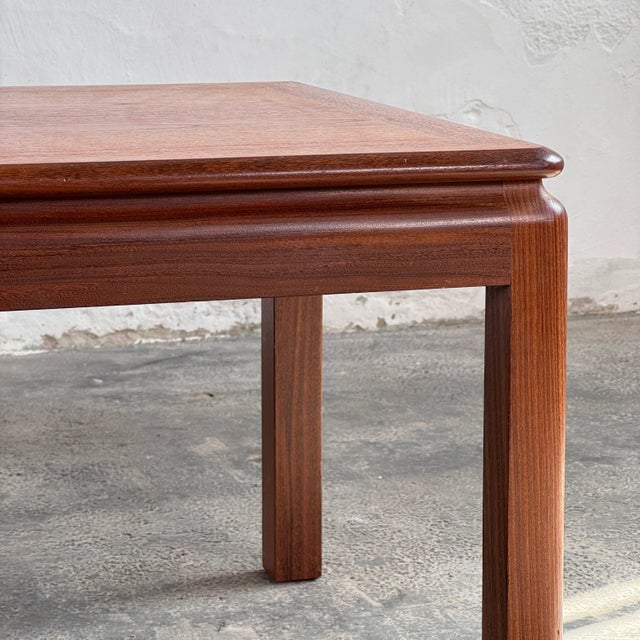 This solid teak coffee table is a beautiful representation of mid-century modern craftsmanship from the 1960s. Unlike many...