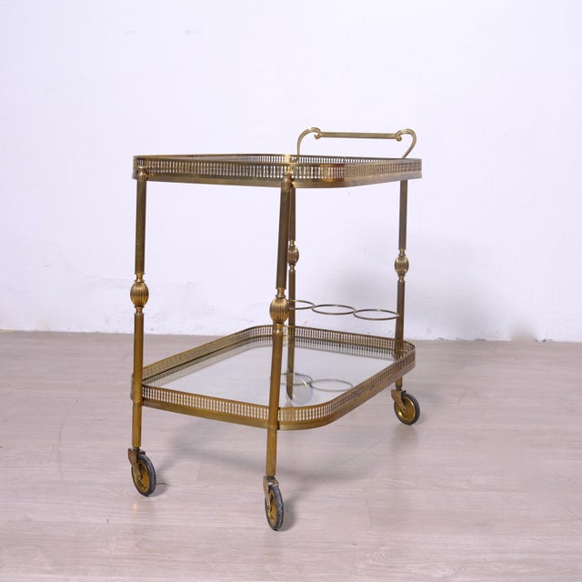 Beautiful bar cart in original 1950s brass. France. An excellent furnishing accessory. Dimensions: Maximum height 71 cm...