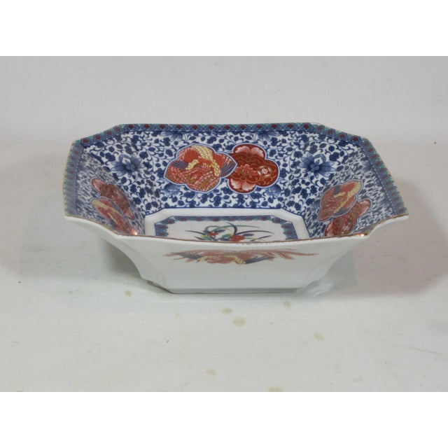 Contemporary Imari style bowl. This square shaped bowl with curved corners is Handpainted with all over floral, scroll and...