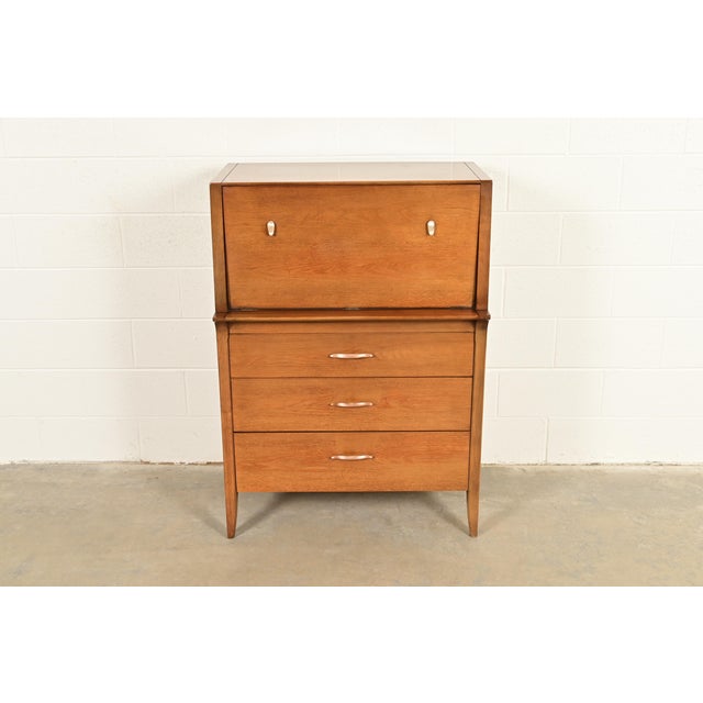 A sleek and stylish Mid-Century Modern highboy dresser or gentleman's chest By John Van Koert for Drexel, "Profile"...