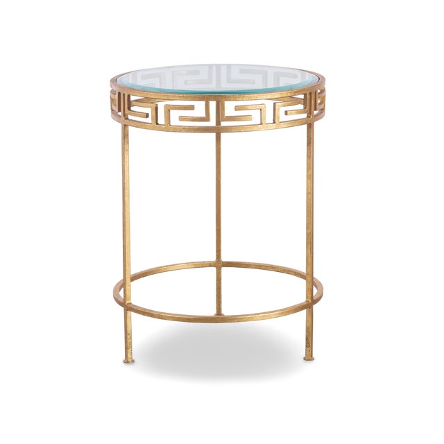 Gold leaf finish on iron base with glass top