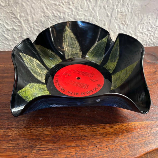 Whimsical painted Pop Art bowl, made from a molded record. Use on a tabletop or wall. Most items found at Pub & Oasis are...