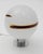 A table or bedside lamp with a spherical globe, reminiscent of the avant-garde creations of Italian firms like Mazzega or...