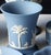 This delightful vintage 1975 matte pale blue Jasperware small, flared bud vase showcases the delicate neoclassical...