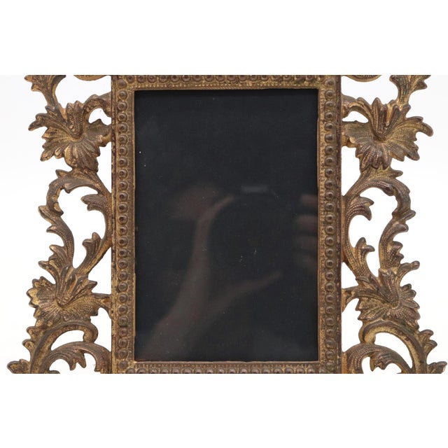 Early 20th century Baroque Revival style table frame in steel with a gilt bronze finish. A beaded frame surrounded by...