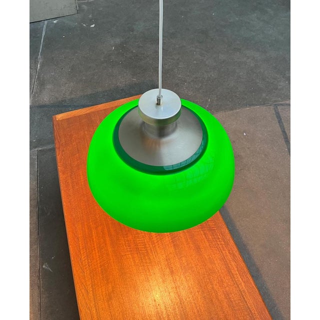 Pendant lamp by Kartell based on a design by Achille and Pier Giacomo Castiglioni from 1959. Here a rare version in green....